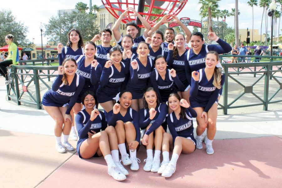 SEU cheerleaders gesturing a zero to signify their zero deduction routine at the National Championship in Orlando, Florida. The team earned a ninth-place finish against 15 other schools.