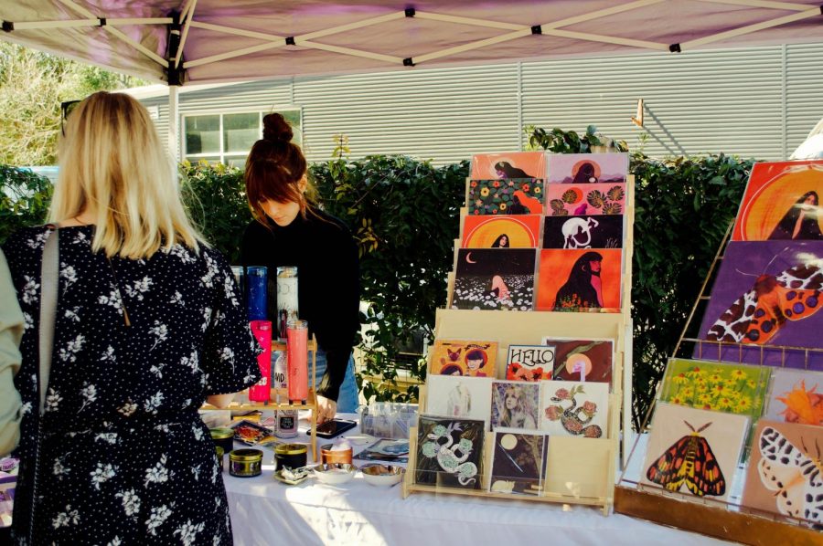 Cayce Matteoli, founder of Earthereal Design, creates and sells multiple-sized prints, cards, candles, stickers and wrapping paper. “I was in a band and toured for six years, and I was making all of our posters,” Matteoli said. “Then, my friend had me make her wedding invitations, and they had such a good response from that it inspired me.” 
