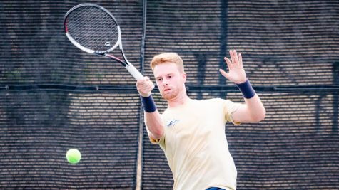 Senior Zac Robinson strikes a forehand shot during a match. Robinson earned the Lonestar Conference Player of the Week for his three victories during last weekend’s doubleheader.