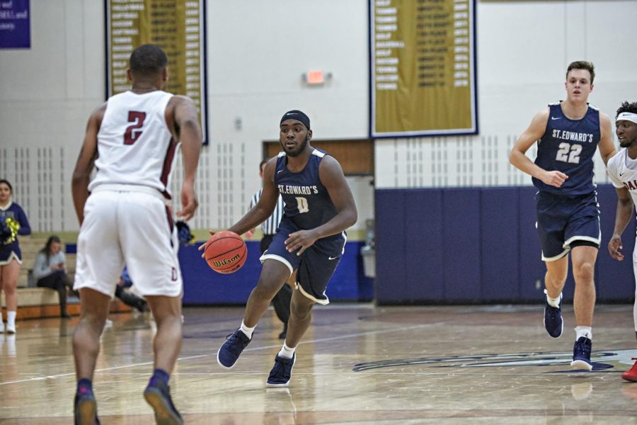 Senior forward Justin Robinson drives to the paint during a 125-66 victory over Dallas Christian College in 2018. Robinson was a contributing factor in the Hilltoppers winning the 2018-2019 Heartland Conference Championship.