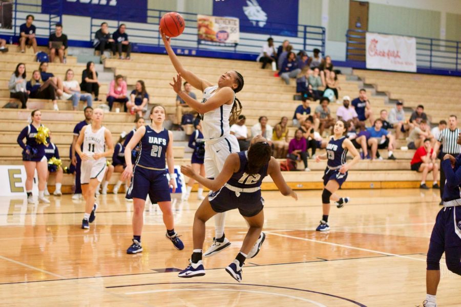 Deijah Blanks (in white) draws sooting foul off of UAFS defender. The Hilltopers finished the regular season 13-9 in conference play. 