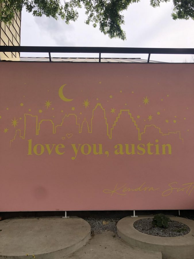 A bright pink mural displays support for Austin in troubling times. SXSW Unofficial was hosted by Kendra Scott, a well-known jewelry company.