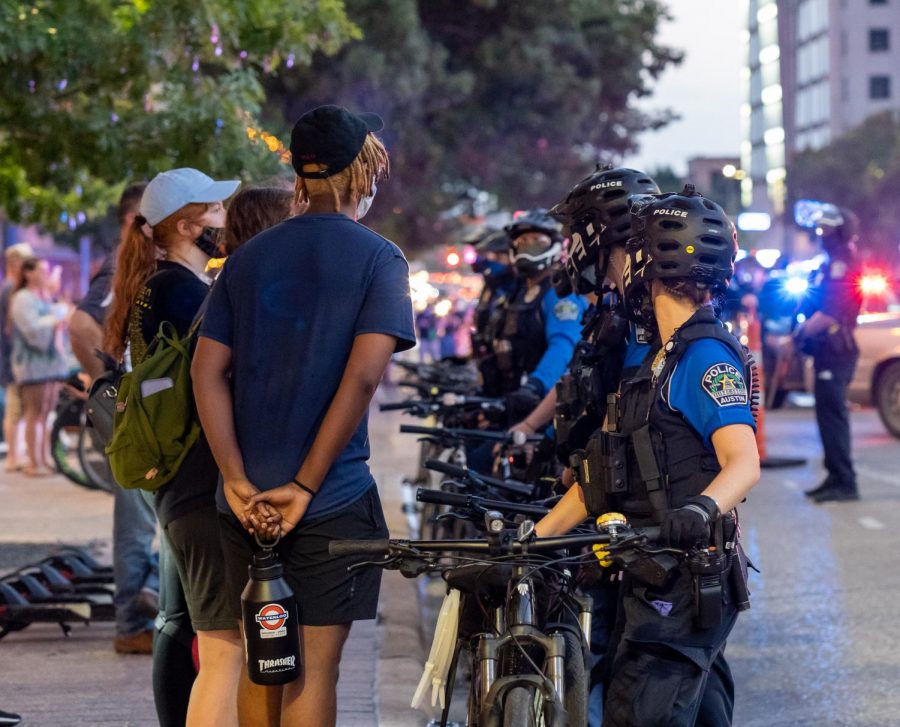 Black Lives Matter protesters face a wall of APD officers. The protests sparked after the killing of George Floyd in late May. 