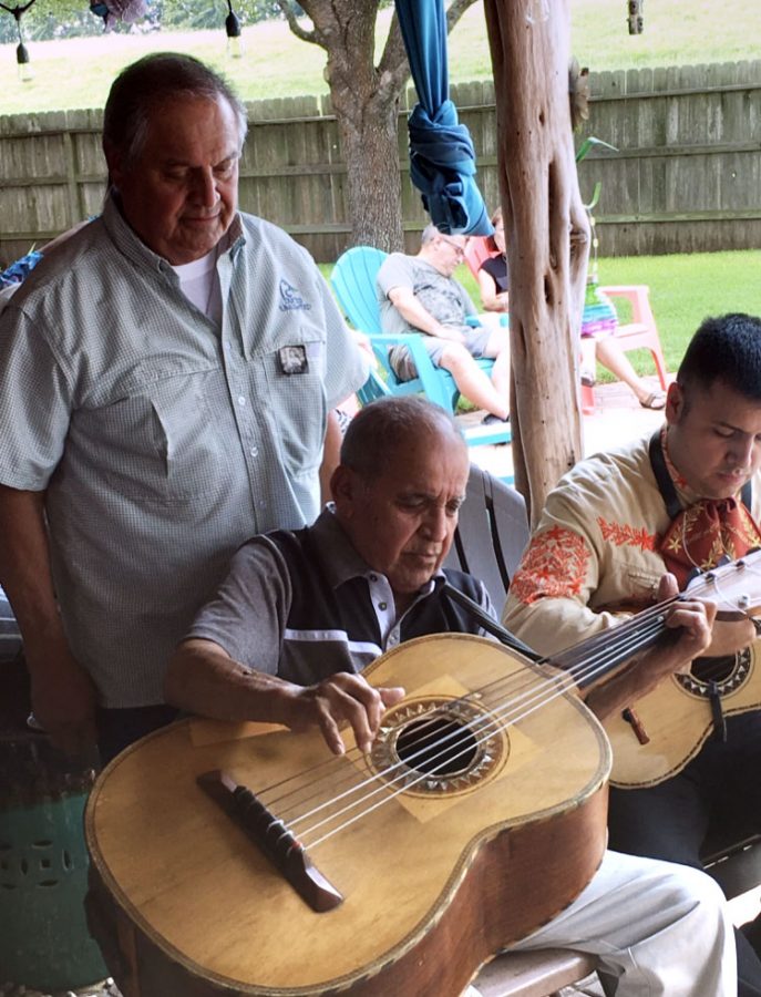 Martinez's tio Raymond Martinez playing the guitarron. The guitarron is a six-string guitar usually used in mariachi. 