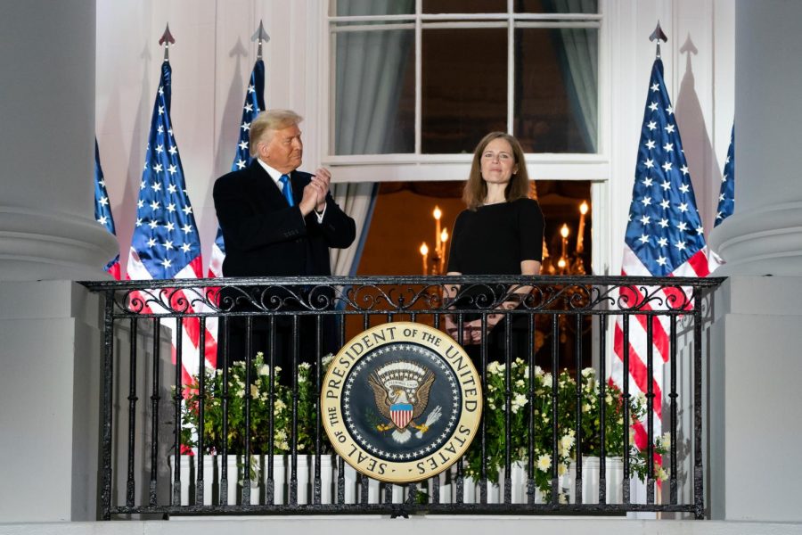 President Trump and Justice Amy Coney Barrett stand together on the Blue Room balcony following Justice Barrett’s swearing-in ceremony. Barrett was nominated on Sept. 26. 