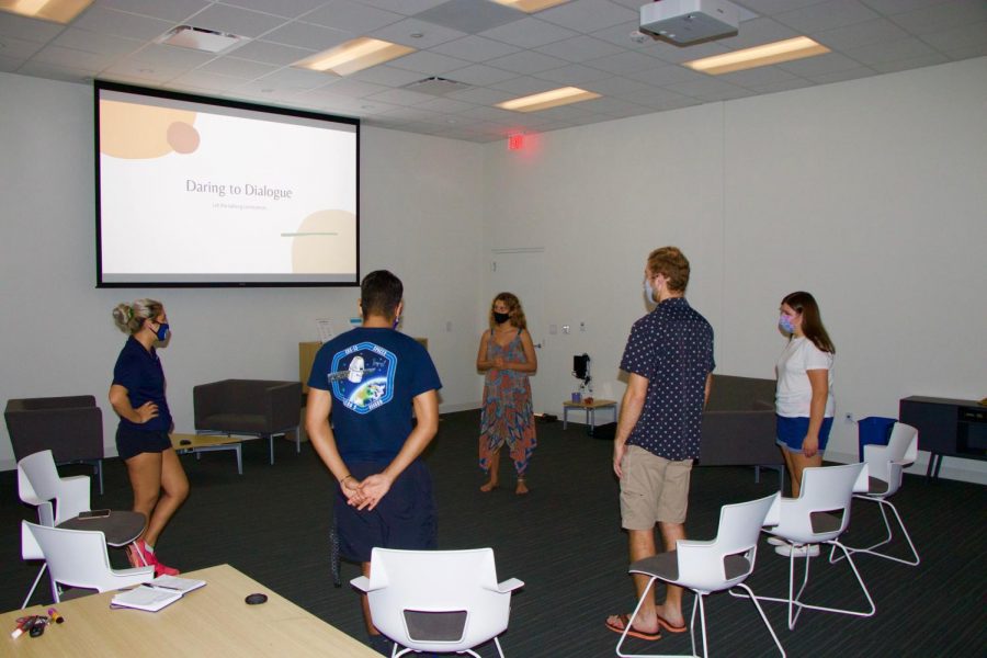 Kate D'Agostino (middle) leads the Daring to Dialogue group. D'Agostino founded the group in hopes of sparking deeper conversations.