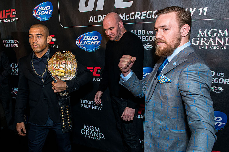 McGregor (right), Dana White (middle) and José Aldo (left) in London as part of the World Tour promoting UFC 189 in March 2015. The Irishmans loss to Poirier at UFC 257 was the first time he had been knocked out in his UFC career. 