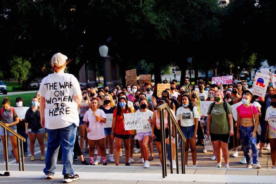 Protests around the new, strict laws on abortion have begun outside of the Texas Capitol building in Austin. A crowd of predominantly women listen as the speaker proclaims that this law means the war on women is here.