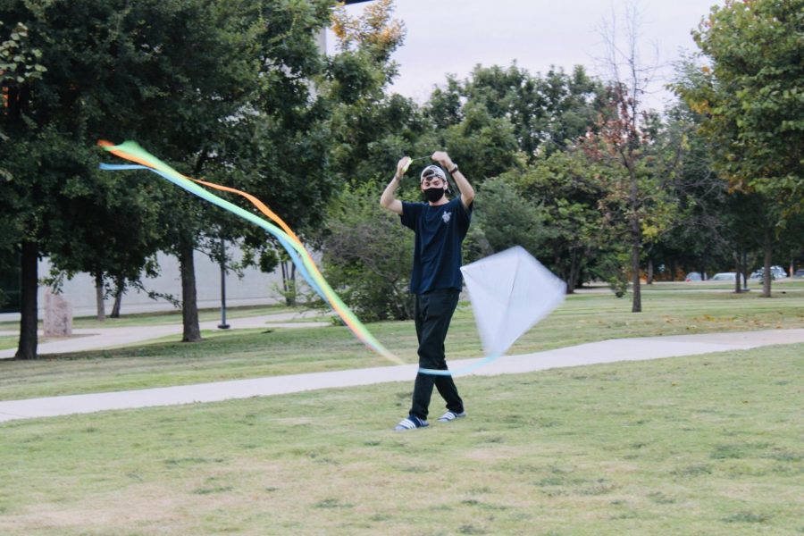 A St. Edward’s University student participates in the kite festival on St. Andre Lawn. The festival marked the end of summer. 