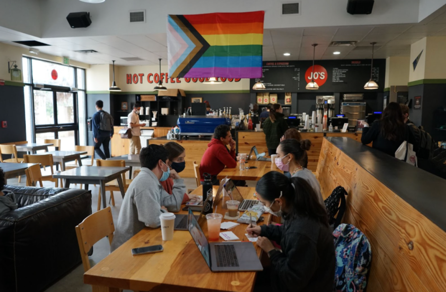 Students gather at Jo's Cafe with the return of indoor seating. Although tables and chairs have been brought back, limited hours remain the same.