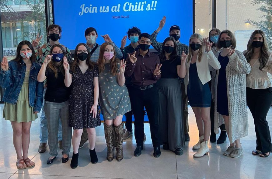 New pledges pose at the end of APO's induction ceremony. While APO is currently not taking anymore pledges this year, the organization hopes more students become involved next recruitment season. 