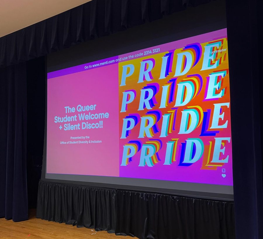 As students arrived, they were greeted with a brightly-colored slideshow describing the importance of having a Queer community on campus and ways to start off the semester right.