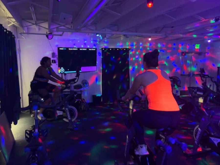 Instructor Jazmine Collins leads students through a Spin class, Monday, Aug. 22.