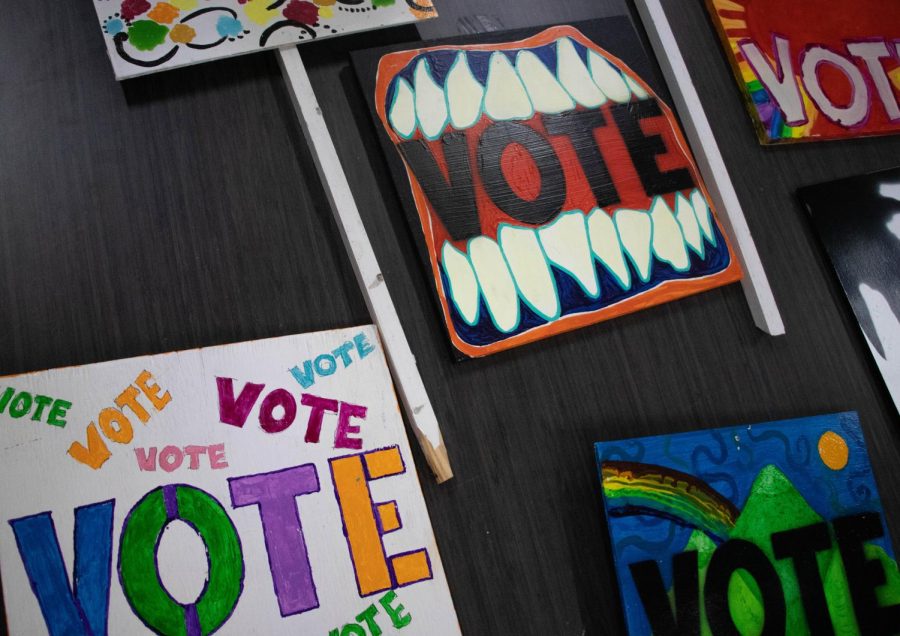 Valérie Horne hosts sign painting workshop where people can create their own unique Vote sign to stake in their yard or place in their front windows.