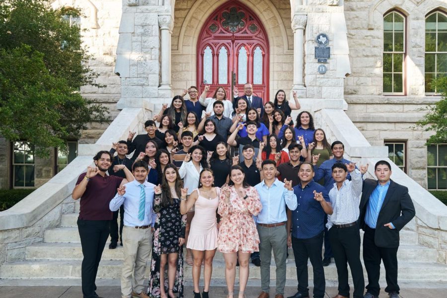 This years CAMP students pose in front of Main Buildings iconic red doors.