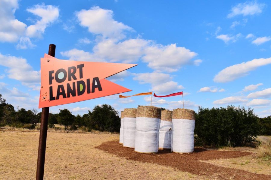 The Fortlandia flag stands in front of Tree Free Fort by Studio Balcones. This fort is made of grass-based products. Studio Balcones plans to donate the 25,000 pounds of hay they used to create this fort to a horse therapy farm. 