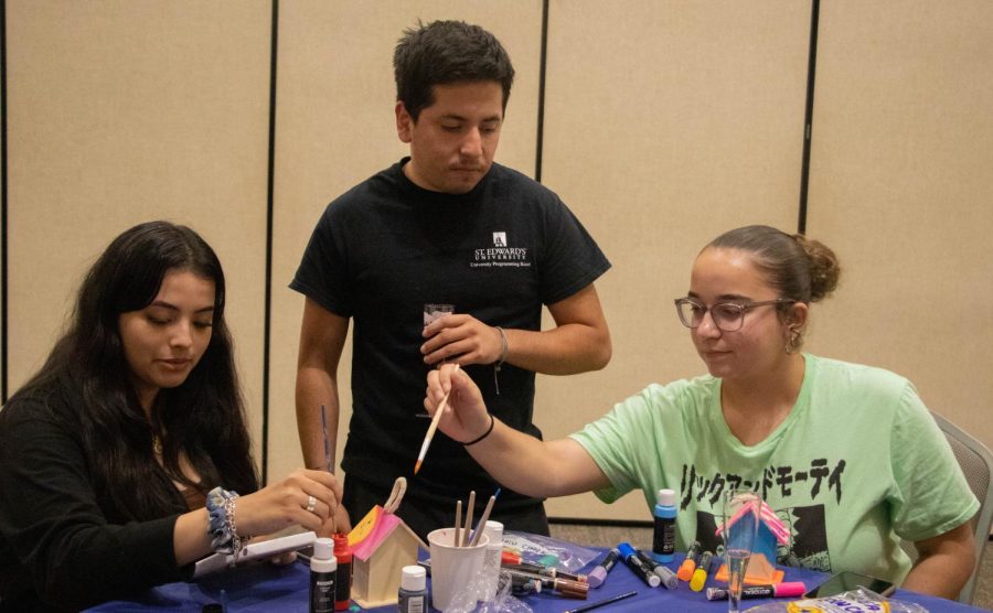 Students and UPB employees (from left) Amanda Ramirez, Ethan Tobias and Ariana Marrero-Massa helped organize the event. They each participated by painting their own bird houses alongside other students in attendance.