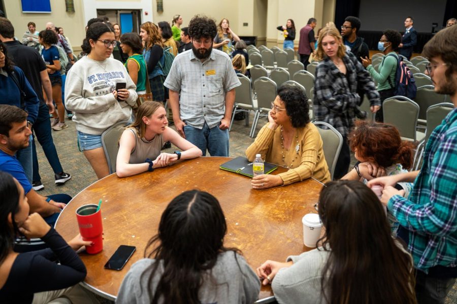 Mayoral candidate Celia Israel sits with various students, faculty and staff in attendance to discuss solutions to Austin’s problems.