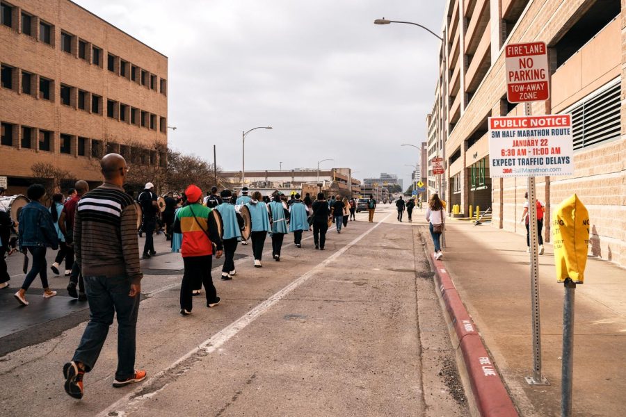 Thousands march from UT’s campus to the steps of the state capitol building.