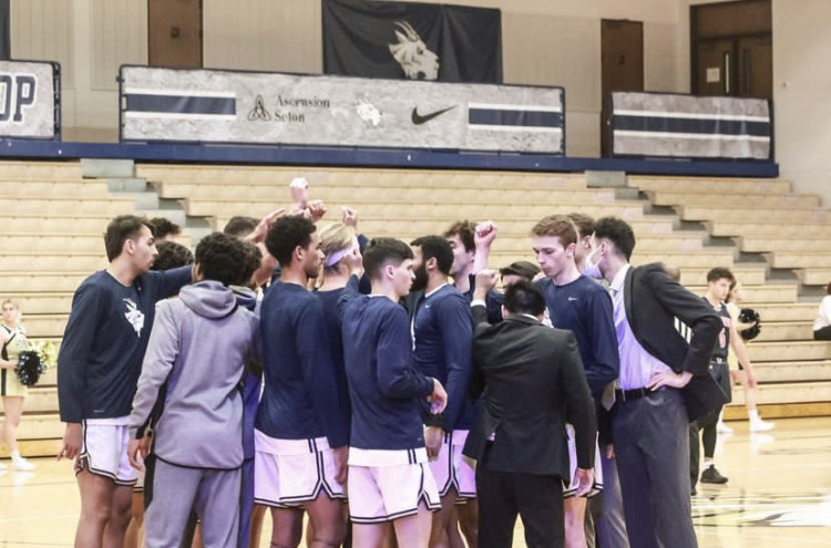 St. Edward’s in the huddle before playing Arlington Baptist on Nov. 15, 2022.