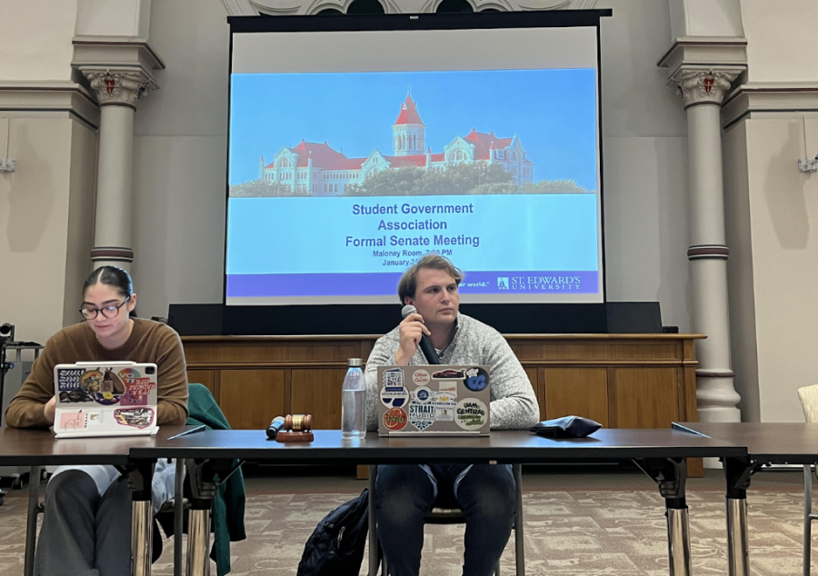 Student Government Association Vice-President Matthew Garrets sits at a table awaiting the senate meeting to begin. 