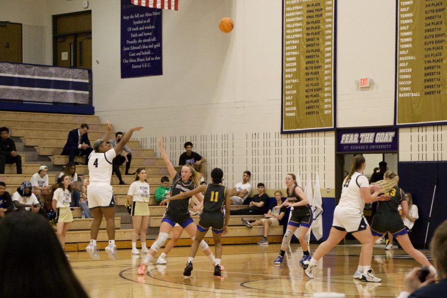 Graduate student Morgan Gary jumps from deep for a three-pointer.