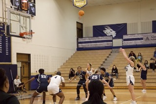 Graduate student Sammie Dufek shoots another free-throw, going 3-4 on the line.