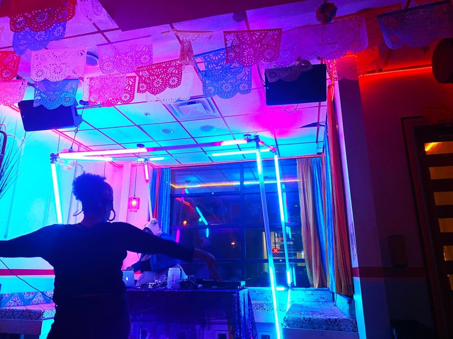 Ali, a regular at Libations, twirls and spins in front of the DJ stand as she feels the music.