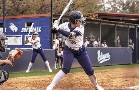 St. Edward’s third baseman Alexis Massie awaits a pitch against Eastern New Mexico on Feb. 26, 2023.