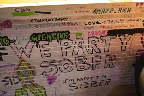 The bar is decorated with hand-written messages and drawings.