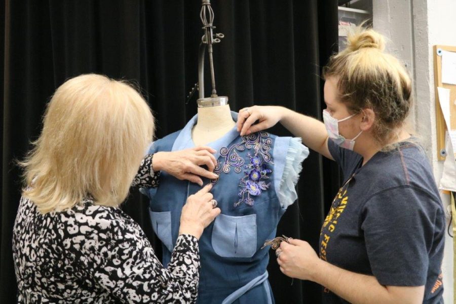 Mancuso (left) supervising one of her student Regan Shawn’s designs for the Mary Moody Northen Theatre‘s production of Luchadora!