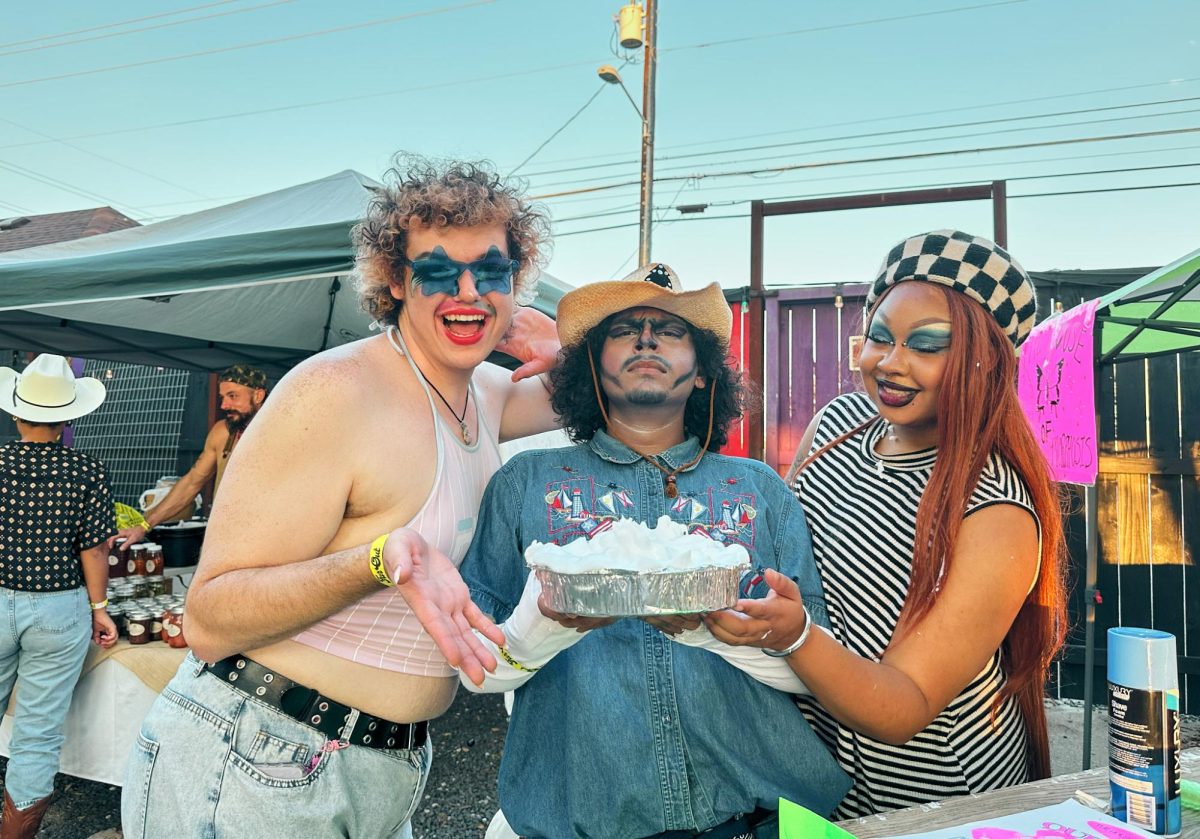 Members of the House of Metamorphosis pose for a picture at the Heel County Fair awaiting to get pied for a charitable cause. The proceeds of their Pie a Queen booth goes toward creating a queer space in San Marcos, Texas.