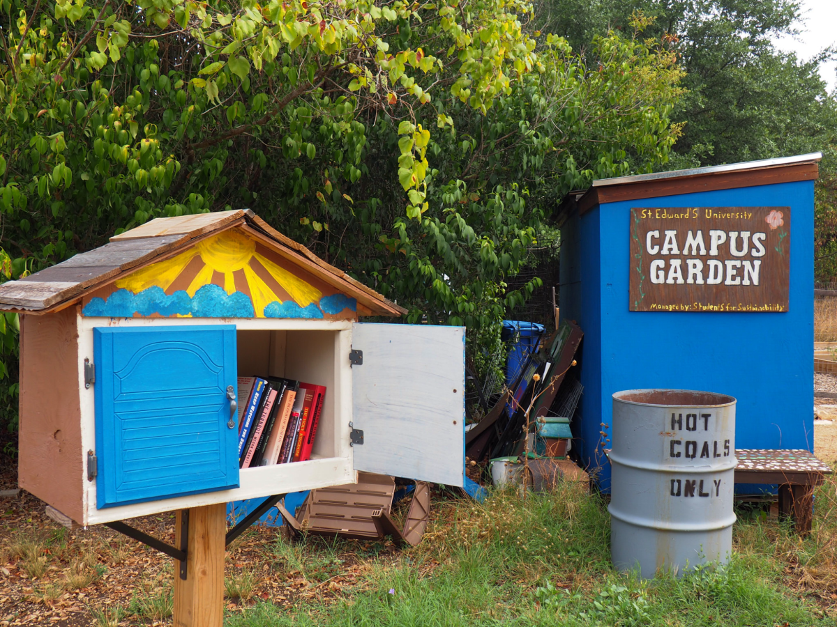 The little library located outside the community garden with books students are encouraged to borrow.