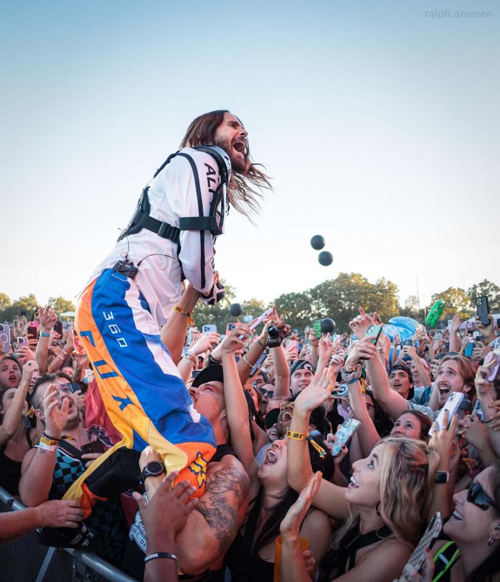 Jared Leto, lead singer of 30 Seconds To Mars, jumps up on the barricade at ACL on Oct. 14.