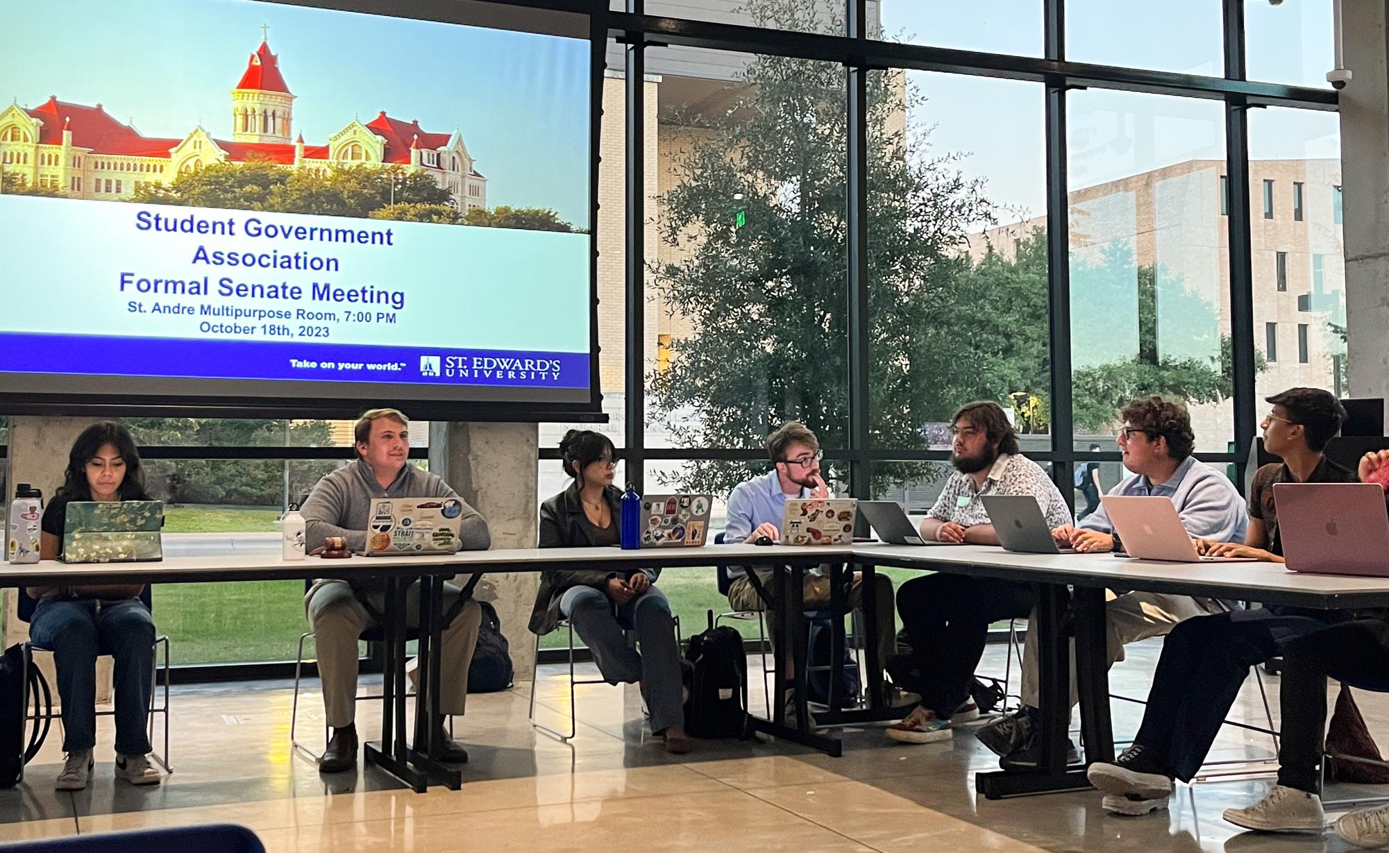 Student Government Association Vice President Matthew Garrets sits at the head of the table during this weeks senate meeting alongside other senate members and senators.