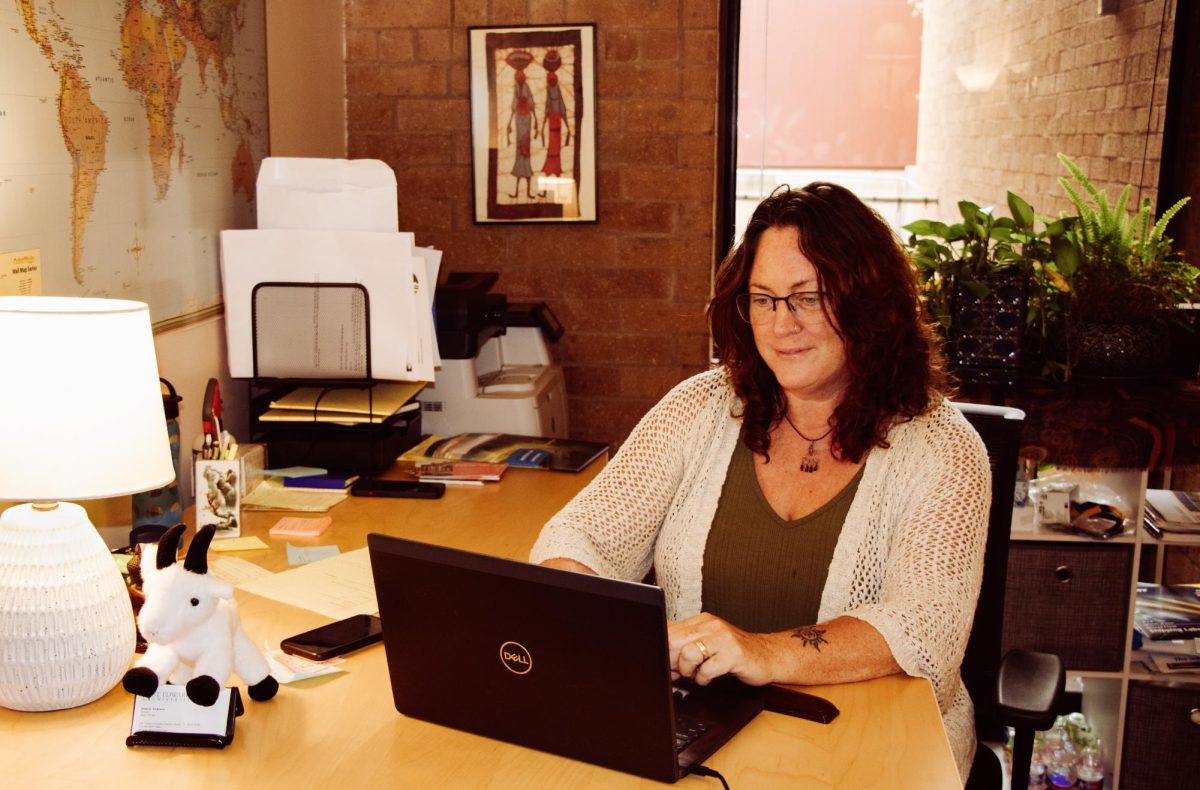 Eleanor Emerson, director of SEU's Study Abroad Office, goes through emails from students seeking to go abroad during the spring semester. 