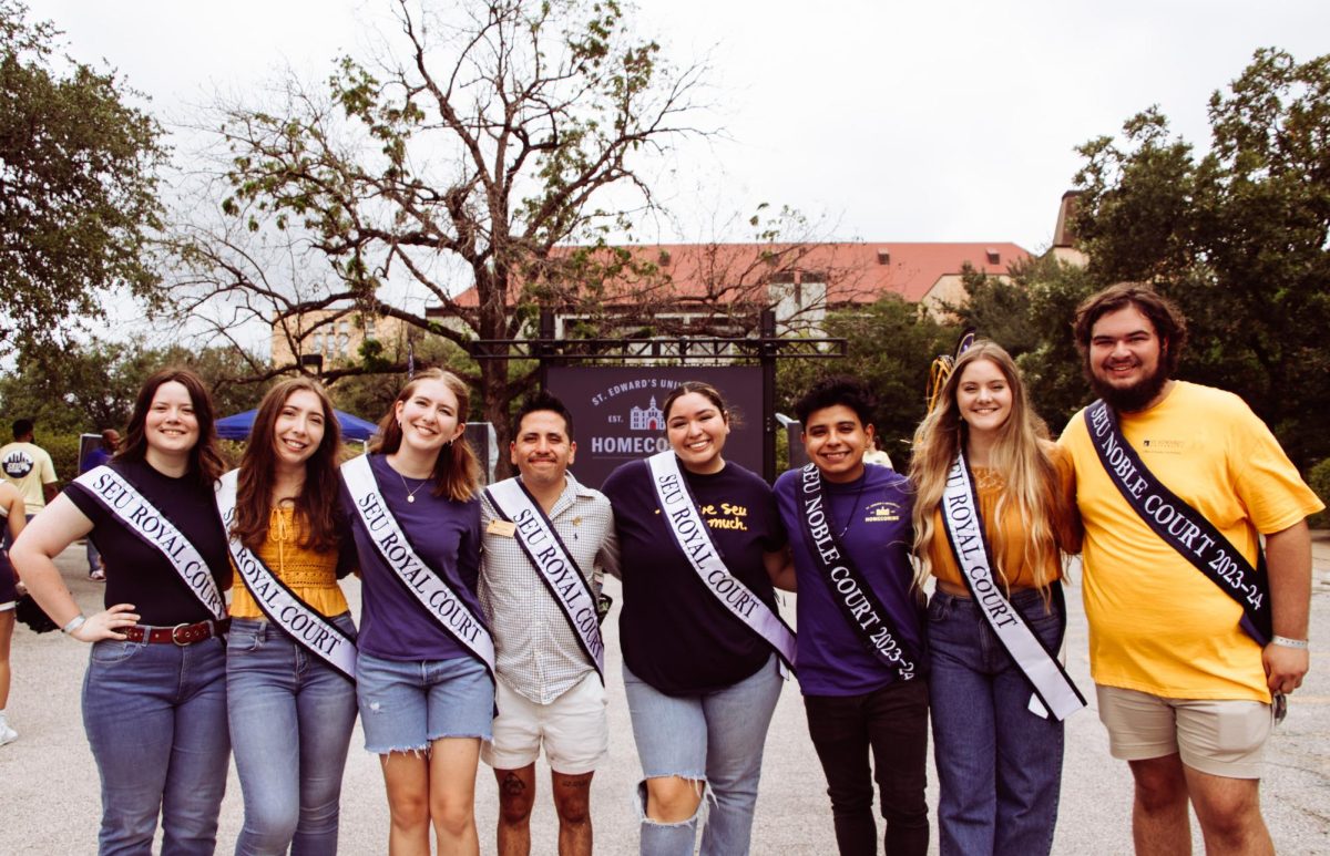The+2023-24+Homecoming+Court+poses+together+after+the+St.+Edwards+homecoming+parade+on+Oct.+28.+%28From+left+to+right%29+Elysheva+Barnett%2C+Kieran+Grones%2C+Liberty+Vela%2C+Ethan+Tobias%2C+Shalom+Armijo%2C+Justin+Trevino%2C+Anna+Southern%2C+Austin+Lane.
