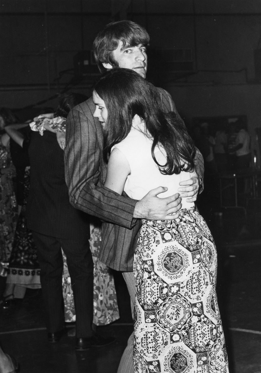 A couple holds each other close during the1972 homecoming fromal. 