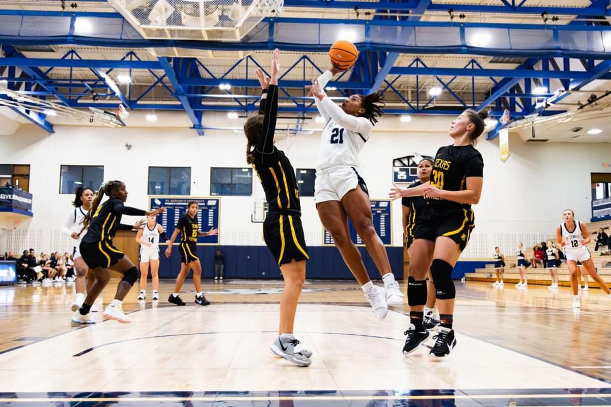 SEU player Bailey Featherstone attempts to score while surrounded by three TLU players.