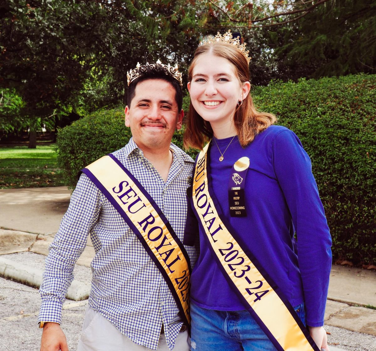 The+two+senior+homecoming+royals+pose+in+their+sashes.+Finishing+their+year+off+strong%2C+they+proudly+wear+their+regalia+for+the+rest+of+the+tailgate.+