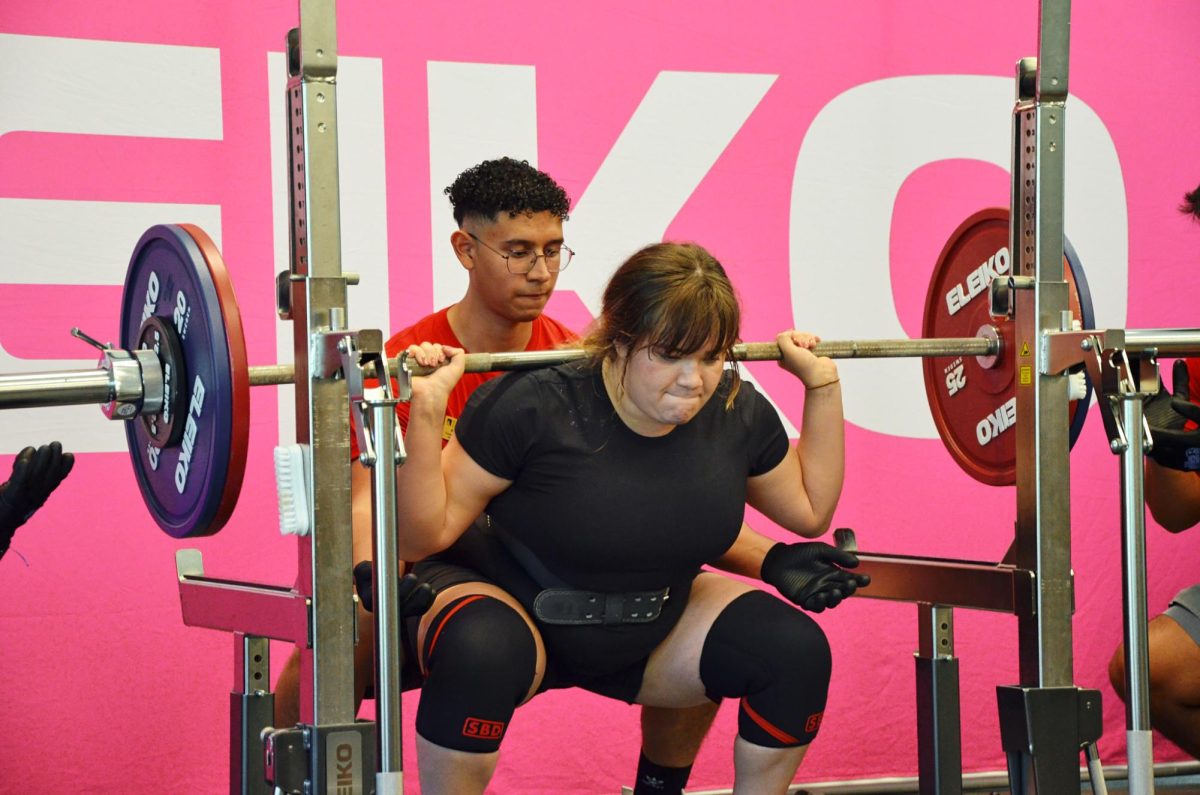 Senior Ellyzabeth Morales-Ledesma prepares for the squat. She competes against herself as the only woman in the meet. She took home the women’s division prize.