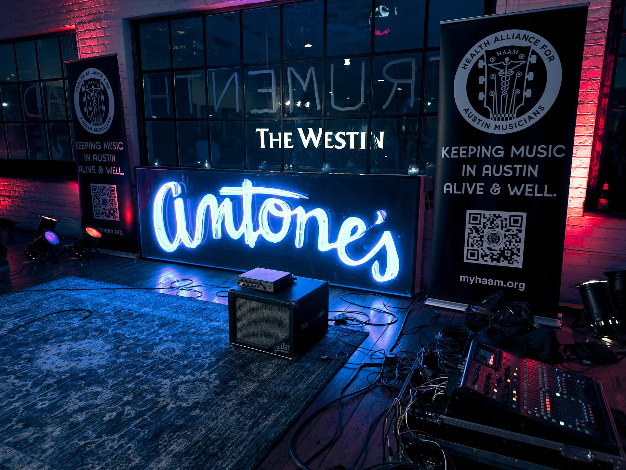 Despite moving locations since its start in 1975, Antones continues to attract musicians and music lovers alike. This iconic piece of blues history here in Austin hosted Michael Weintrobs Instrumenthead Invasion gallery from Nov. 2 through Nov. 6. As part of the gallerys immersive experience, various musicians, including the Soul Supporters, Natalie Price, Gordie Johnson and Matt Hubbard, jammed on a make-shift stage throughout the exhibition. The stage itself had a simple setup: a couple amps, cords running around a patterned rug and a neon blue light spelling out Antones in the background.