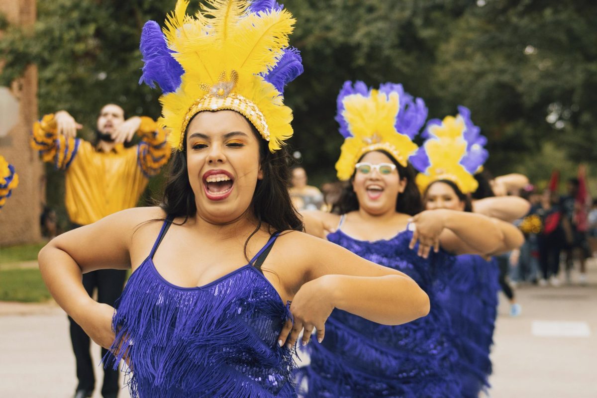 Department of Arts and Humanities led the way with colorful signs, bubbles and a performance. 