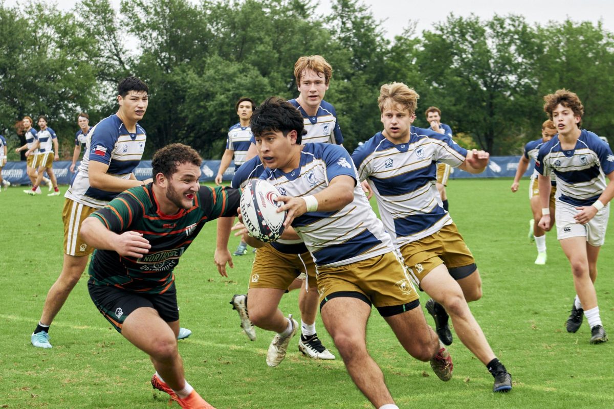 Eighthman senior Vincent Villanueva traveling the ball towards the St. Edwards end-zone. The Eighthman is responsible for aiding the scrum, when the eight biggest players from each side try to get the ball. At the end of the scrum, the eighthman can get the ball and run it. 