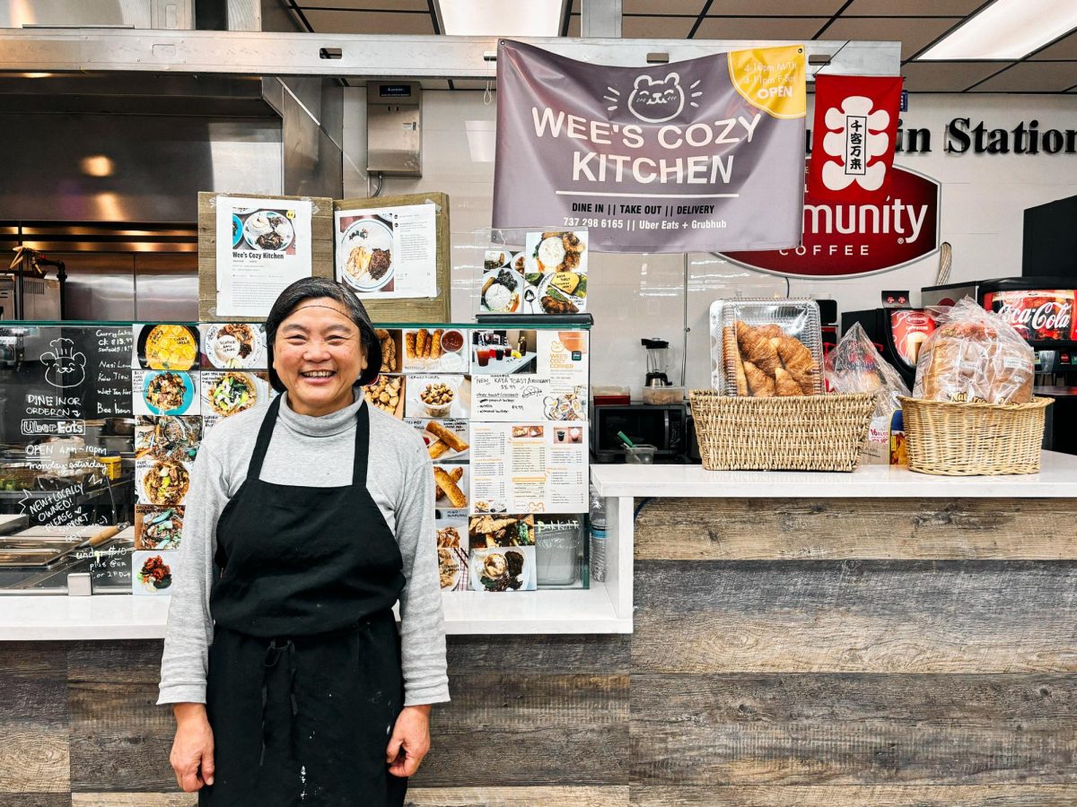 Wee poses proudly in front of her menu, tucked away in the corner of a Shell gas station. She was excited to greet guests and welcome them into her restaurant.