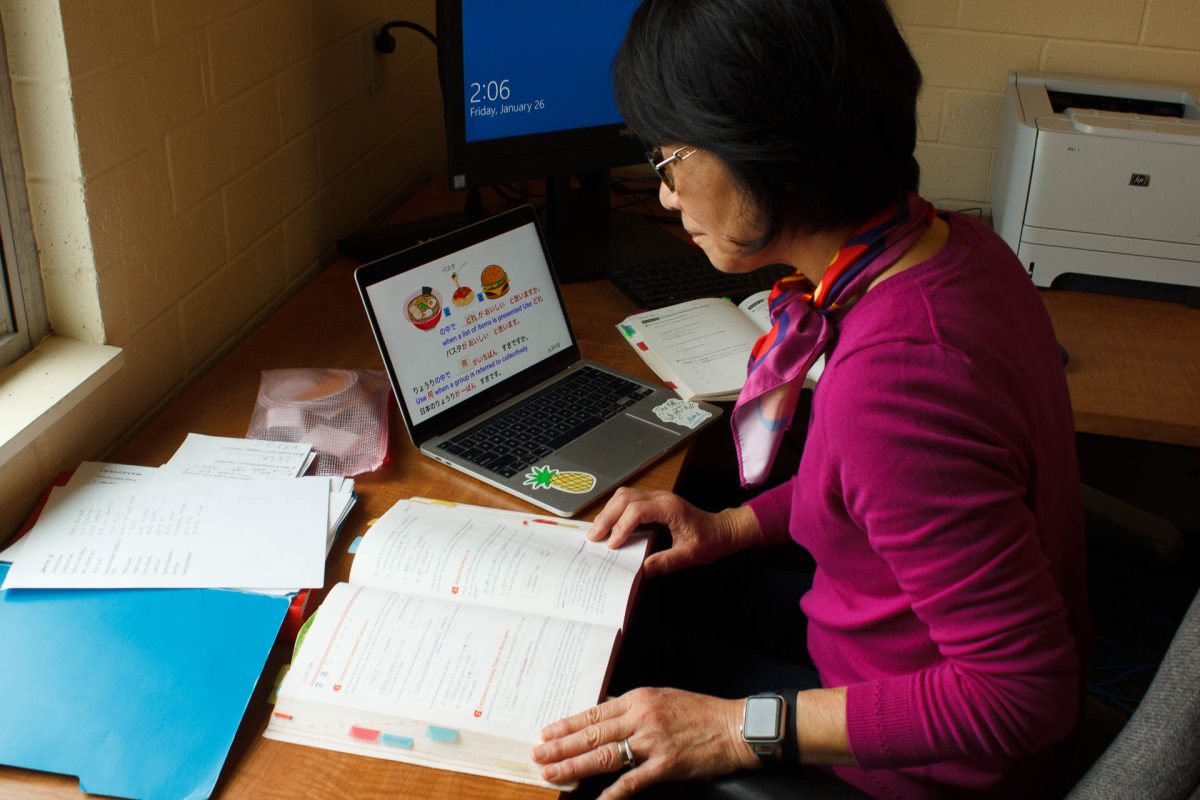 Professor Risa Ginther is going over her lessons in the adjunct professor offices. She makes an effort to integrate popular culture and her students' interests with the textbook lessons to make sure students stay interested and engaged.