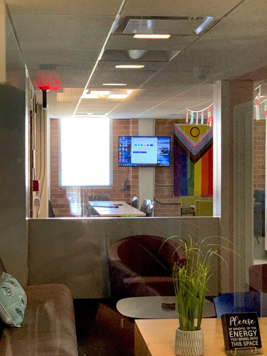 The Pride flag referenced in St. Edward's University's statement hanging on the wall of the Office of Equity and Employee Relations in Equity Hall room 131. 