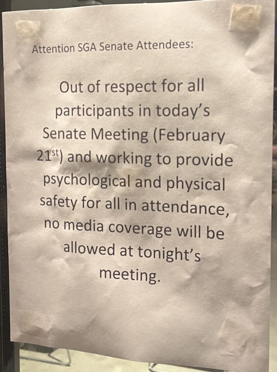 This sign was posted at the entrance of the St. Andre Multipurpose Room. 