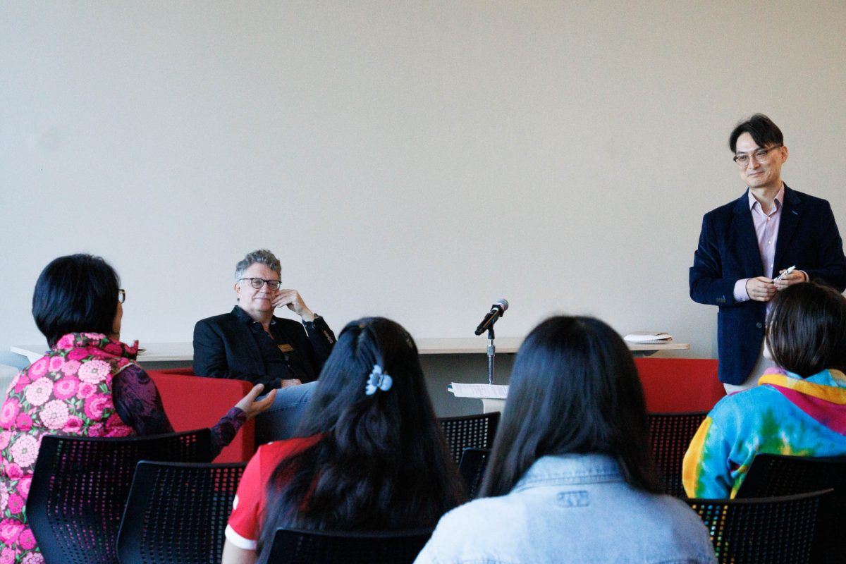 St. Edward’s associate professor of finance Sung Suh (right) during the Q&A.