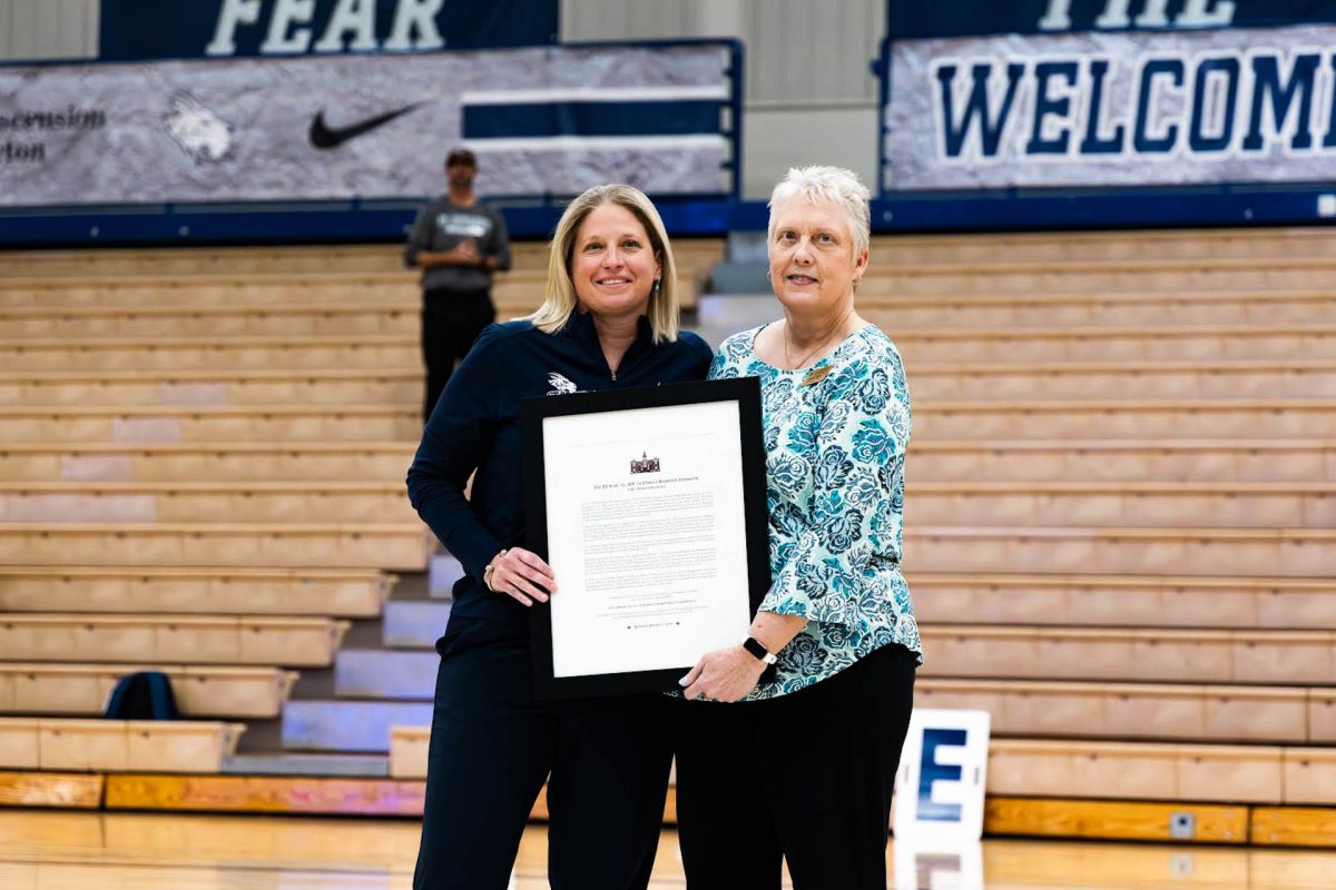 On Feb. 3, Debbie Taylor (right) helped introduce the J.J. Riehl (left) endowment, a $25,000 anonymous donation made toward the womens basketball program. Taylor has been a part of Hilltoppers Athletics since 1990 and has helped several programs expand and her work is one of the things that made this donations possible. 